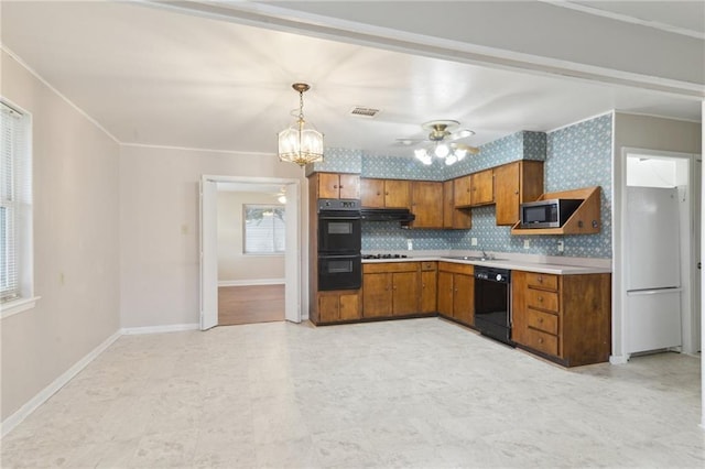 kitchen with black appliances, a sink, crown molding, brown cabinetry, and light countertops