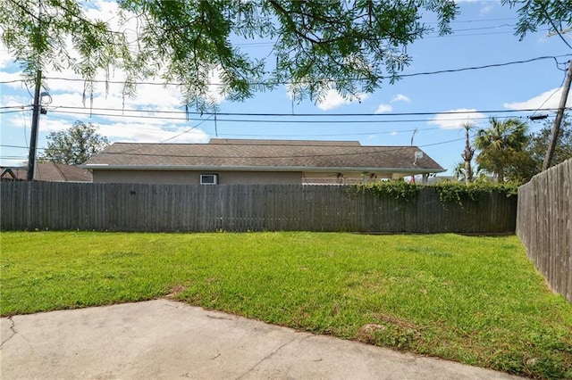 view of yard with a patio and a fenced backyard