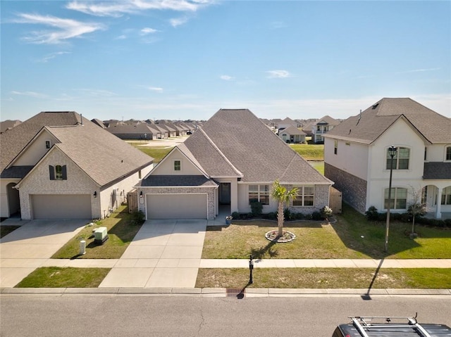 french country style house with a front yard, a residential view, concrete driveway, a garage, and brick siding