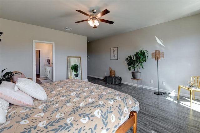 bedroom with visible vents, baseboards, wood finished floors, and a ceiling fan