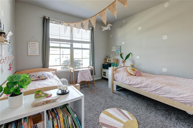 carpeted bedroom featuring baseboards