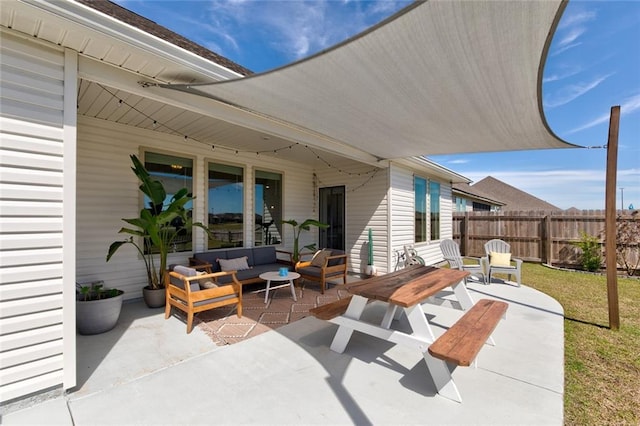 view of patio / terrace with fence and an outdoor hangout area