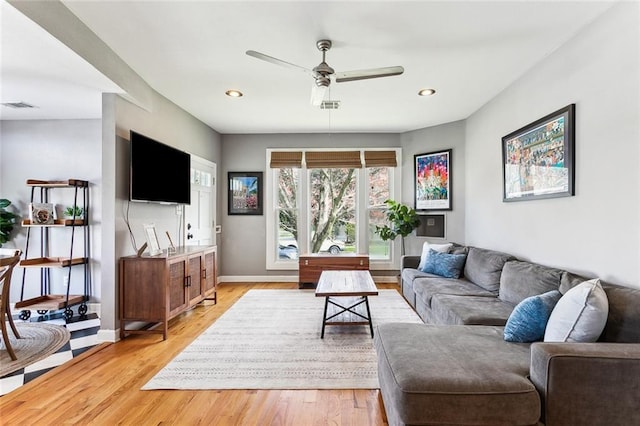 living area with a ceiling fan, recessed lighting, light wood-style floors, and visible vents