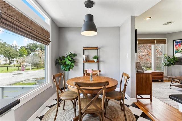 dining area featuring a wealth of natural light, visible vents, recessed lighting, and baseboards