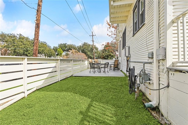 view of yard with a patio and a fenced backyard