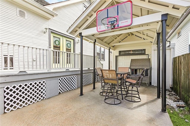 view of patio / terrace featuring outdoor dining area and fence