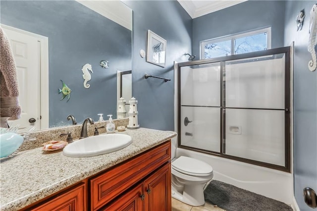 full bath with tile patterned floors, toilet, ornamental molding, enclosed tub / shower combo, and vanity