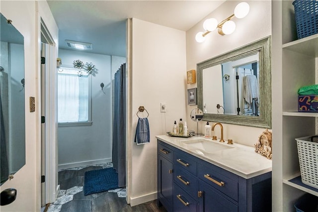 full bathroom with baseboards, a shower with curtain, and vanity