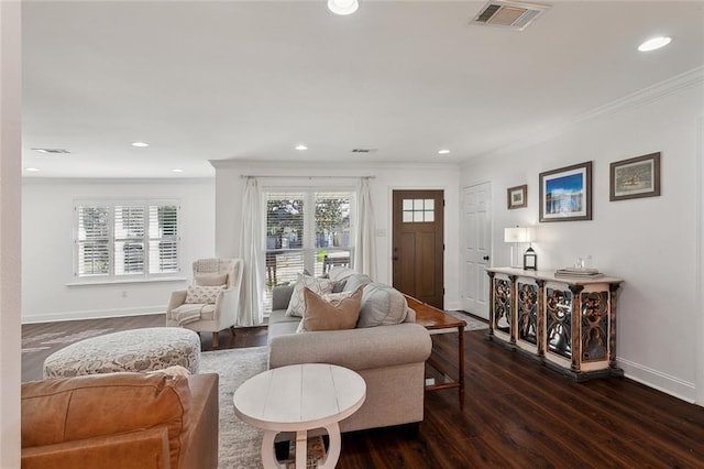 living room featuring crown molding, dark wood-style floors, visible vents, and baseboards