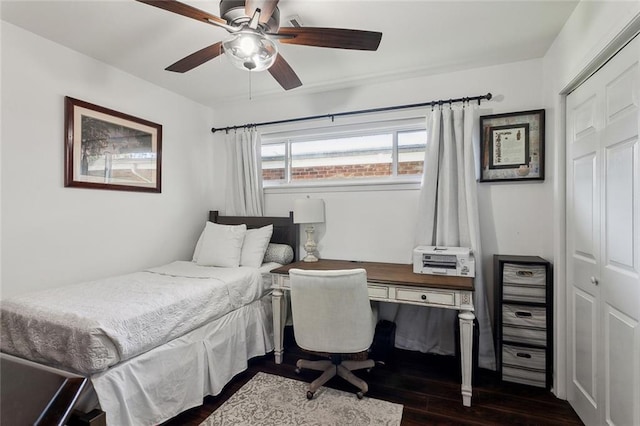 bedroom featuring a closet, a ceiling fan, and dark wood-style flooring