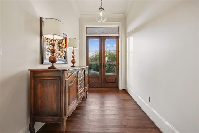 doorway to outside featuring french doors, baseboards, ornamental molding, and dark wood-style flooring