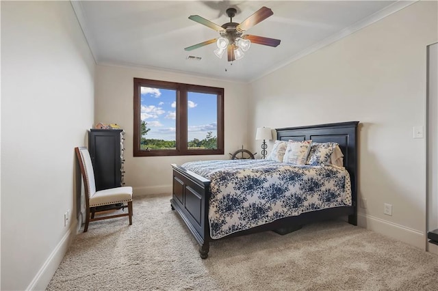 bedroom with visible vents, ornamental molding, baseboards, light colored carpet, and ceiling fan