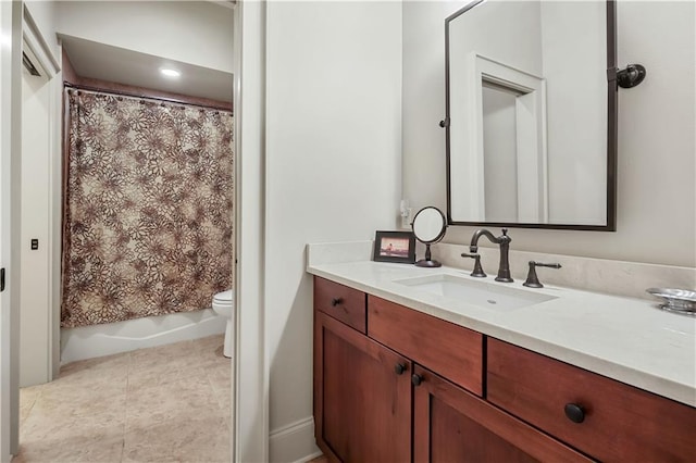 full bathroom with tile patterned floors, shower / bath combo with shower curtain, toilet, and vanity