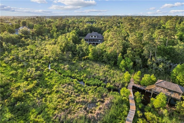 drone / aerial view featuring a view of trees