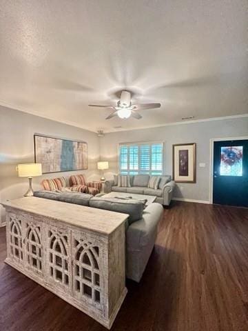 living room with baseboards, a ceiling fan, dark wood-style flooring, and crown molding