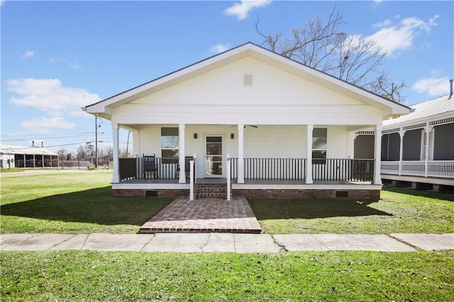 view of front of home with crawl space, a porch, and a front lawn