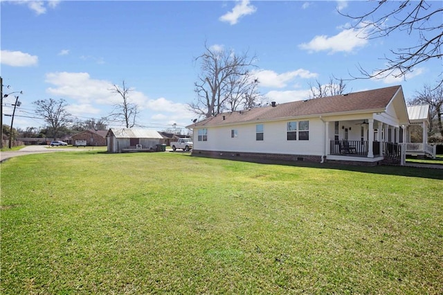 back of house featuring crawl space, a yard, a porch, and ceiling fan