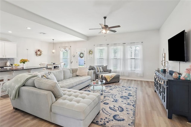 living room featuring light wood-style flooring, recessed lighting, a healthy amount of sunlight, and ceiling fan