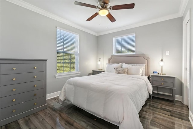 bedroom featuring dark wood finished floors, multiple windows, and crown molding