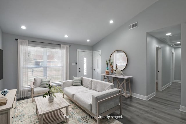 living room featuring visible vents, wood finished floors, recessed lighting, baseboards, and vaulted ceiling