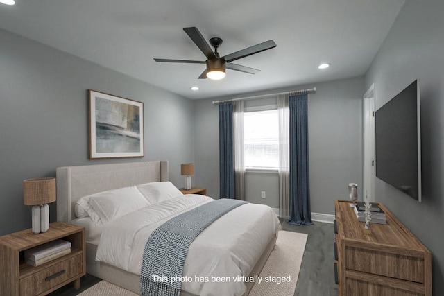 bedroom featuring a ceiling fan, wood finished floors, recessed lighting, and baseboards