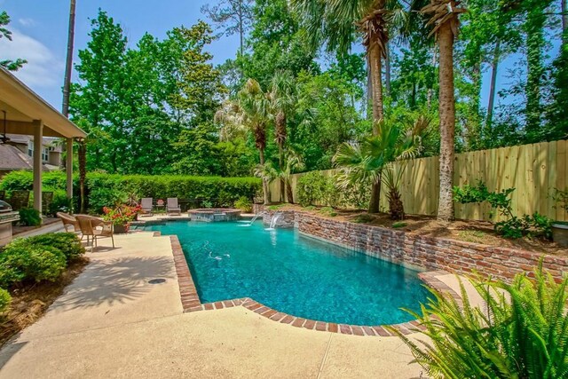 view of swimming pool with a patio area, a fenced in pool, an in ground hot tub, and a fenced backyard