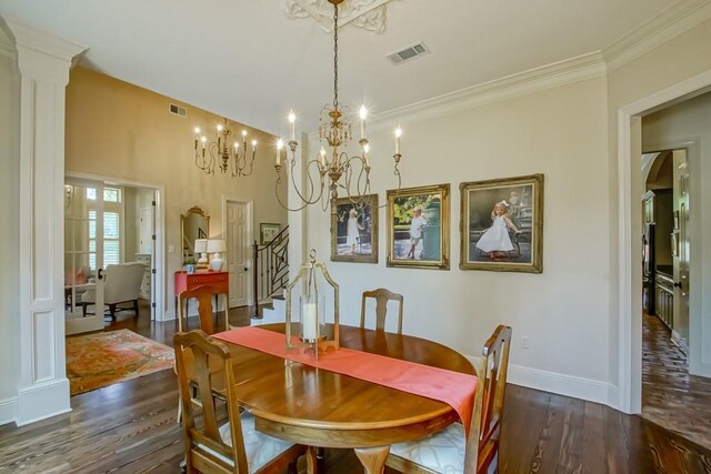 dining space featuring visible vents, arched walkways, wood finished floors, and ornate columns