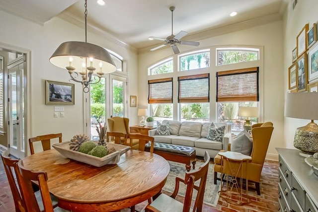 sunroom / solarium with visible vents and ceiling fan with notable chandelier