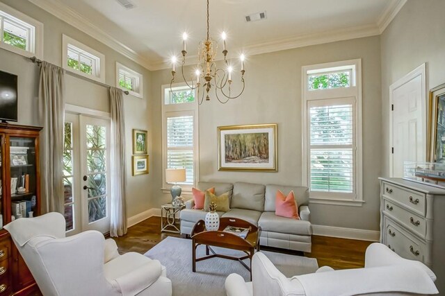 living area featuring visible vents, ornamental molding, french doors, baseboards, and dark wood-style flooring