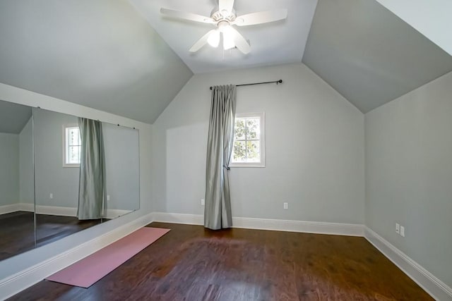 bonus room featuring a wealth of natural light, baseboards, and wood finished floors