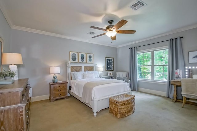 bedroom with visible vents, light colored carpet, baseboards, and ornamental molding