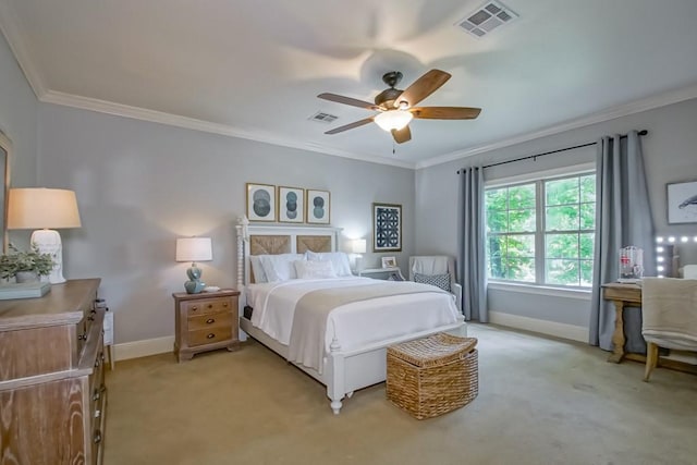 bedroom featuring crown molding, baseboards, visible vents, and light carpet