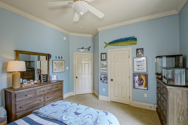 bedroom featuring ceiling fan, baseboards, carpet floors, and ornamental molding