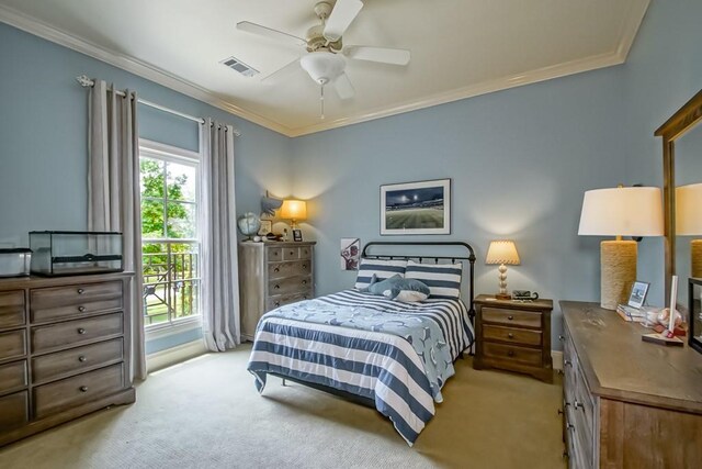 bedroom with access to exterior, visible vents, light colored carpet, and ornamental molding