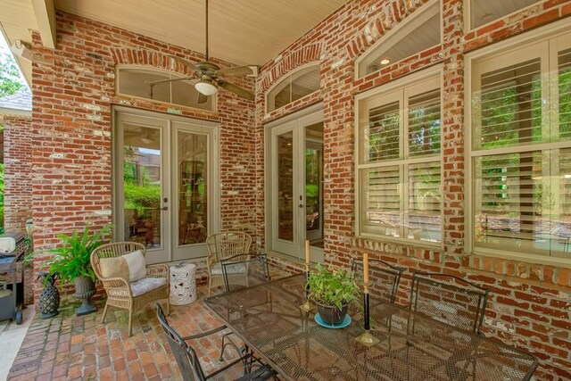 view of patio with french doors and a ceiling fan