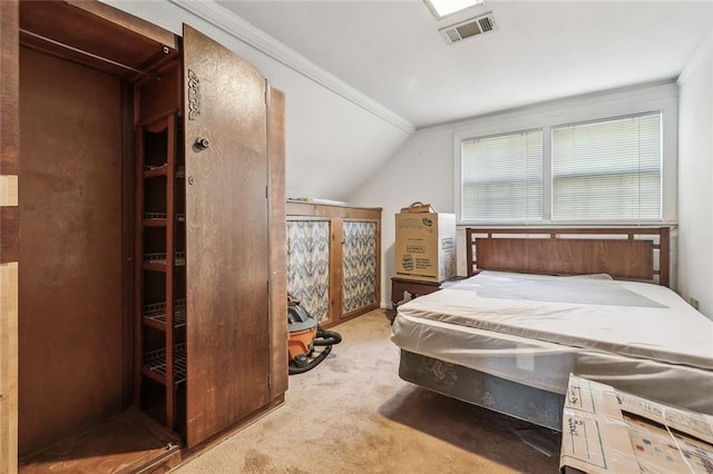 carpeted bedroom featuring vaulted ceiling and visible vents