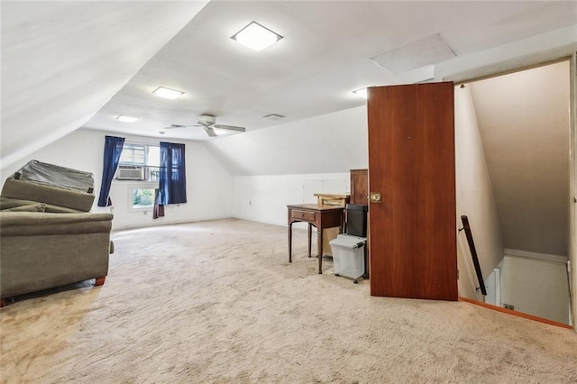 interior space featuring vaulted ceiling, cooling unit, carpet, and ceiling fan