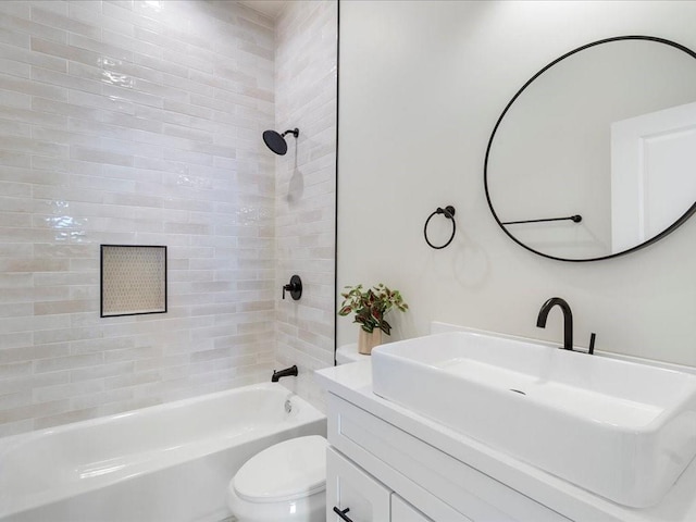 full bath with vanity, shower / tub combination, and toilet