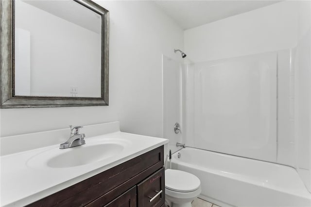 bathroom featuring vanity, toilet, and tub / shower combination