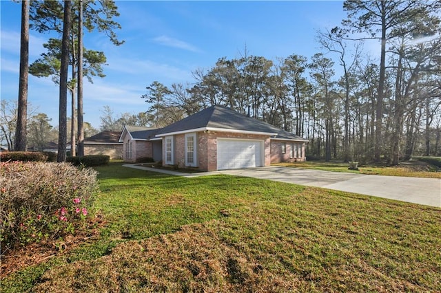 105 Cherokee Dr, Abita Springs, LA 70420 - view of home's exterior featuring an attached garage, concrete driveway, brick siding, and a lawn