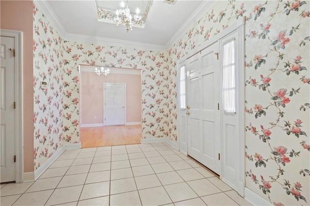 entryway featuring light tile patterned floors, a chandelier, crown molding, and wallpapered walls