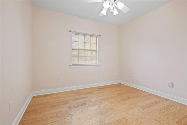 empty room featuring light wood-style floors, baseboards, and ceiling fan