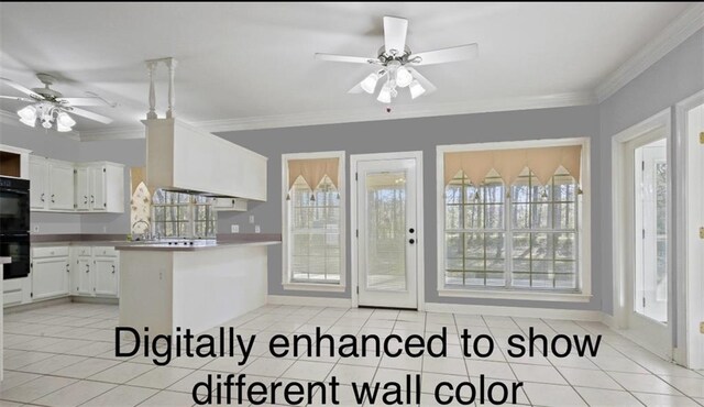 105 Cherokee Dr, Abita Springs, LA 70420 - kitchen featuring a ceiling fan, light tile patterned floors, white cabinets, crown molding, and a peninsula