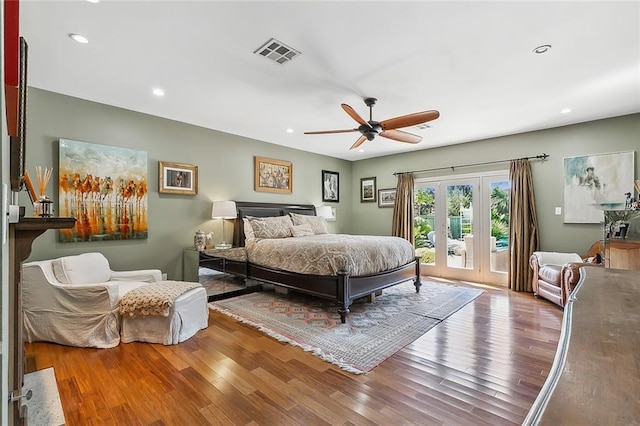 bedroom featuring recessed lighting, visible vents, wood finished floors, and access to exterior