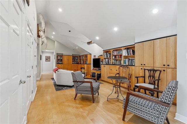 living area featuring light wood finished floors, recessed lighting, ceiling fan, and vaulted ceiling