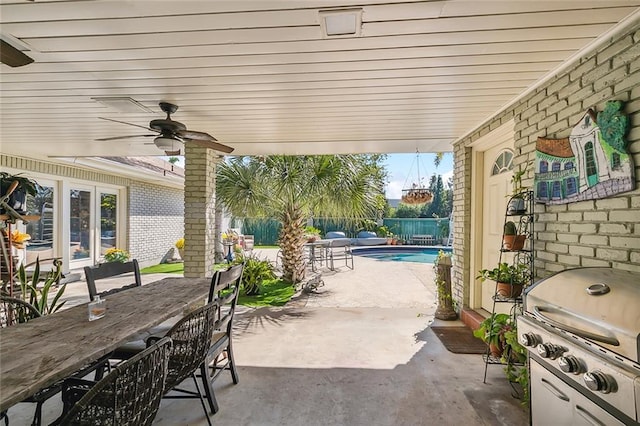 view of patio / terrace featuring a ceiling fan, a fenced backyard, grilling area, outdoor dining area, and a fenced in pool