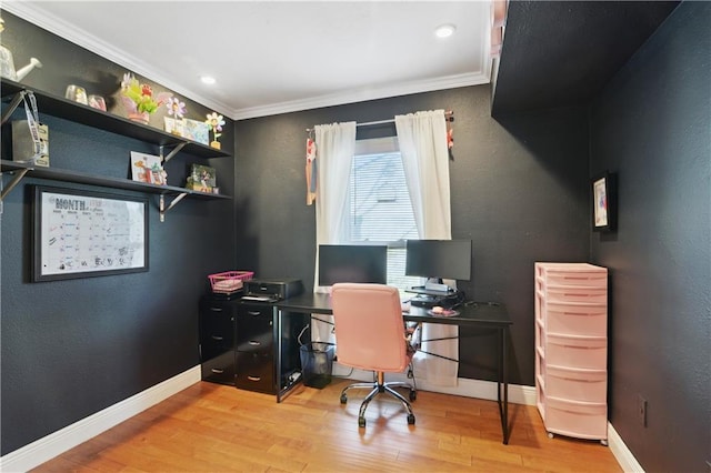 office area featuring baseboards, wood finished floors, and crown molding