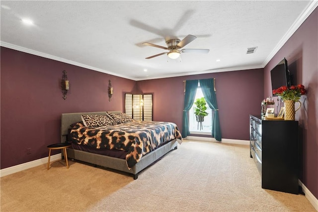 carpeted bedroom with ceiling fan, crown molding, baseboards, and a textured ceiling