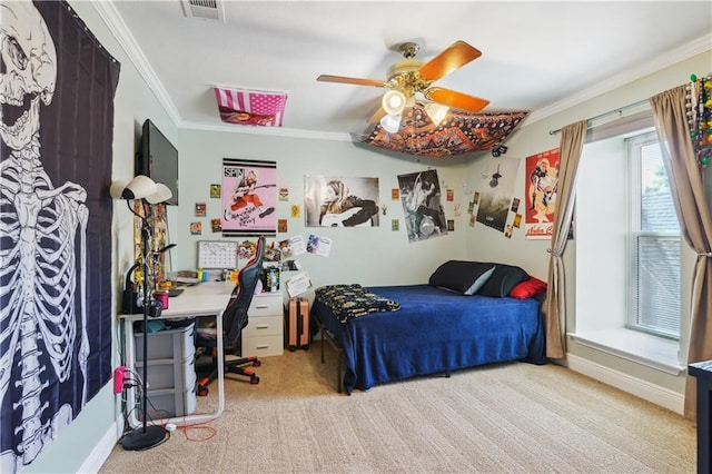 bedroom featuring visible vents, baseboards, ornamental molding, carpet flooring, and a ceiling fan