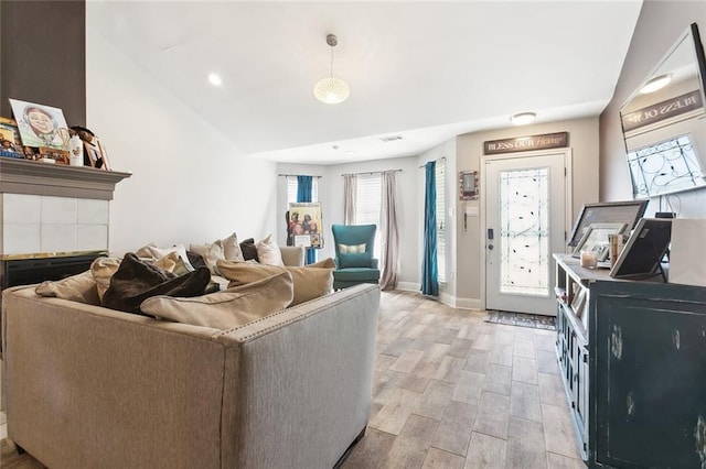 living area featuring light wood-style flooring and baseboards